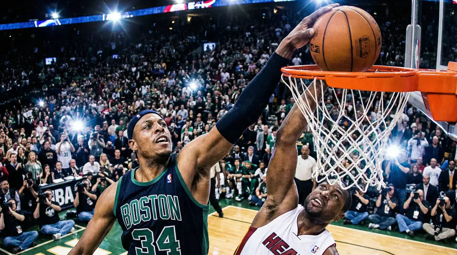 Basketball defender blocking shot at the rim during NBA game